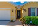 Close-up of the home's facade showcasing an inviting entryway with decorative elements at 7501 Mikasa Dr, Punta Gorda, FL 33950