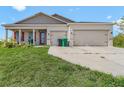 Inviting single-Gathering home with a well-manicured lawn and a welcoming front entrance at 15345 Pottstown Ave, Port Charlotte, FL 33981