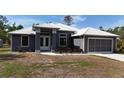 Attractive single-story house with neutral paint, new roof, and manicured front landscape at 3136 Joshua St, Port Charlotte, FL 33948