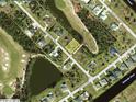 Aerial view of a residential lot in a waterfront community near a golf course and the Rotonda River at 7 Pine Valley Ct, Rotonda West, FL 33947