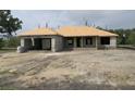 A new construction home with block and partial roof, awaiting customization at 7 Pine Valley Ct, Rotonda West, FL 33947