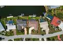 Aerial view of a home with boat dock, pool, and waterfront access at 925 Don Juan Ct, Punta Gorda, FL 33950