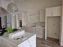 Elegant kitchen featuring modern appliances, quartz countertops, and custom cabinetry at 10522 Riverside Rd, Port Charlotte, FL 33981