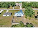 Aerial view of the property highlighting the fenced backyard and metal roof at 1210 Marlow St, Port Charlotte, FL 33952