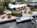 Picturesque waterfront home with private dock and lush landscaping at 187 Beeney Se Rd, Port Charlotte, FL 33952
