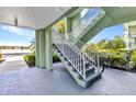 Exterior stairway up to the residences, and near the assigned parking, makes coming and going a breeze at 2020 Willow Hammock Cir # 302, Punta Gorda, FL 33983