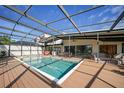 Gorgeous screened pool area with ample seating, a hot tub, and a spacious deck at 25188 Marion Ave # 10, Punta Gorda, FL 33950