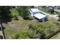 An aerial perspective of the property's backyard, offering a glimpse of outdoor space at 899 S Broadway, Englewood, FL 34223