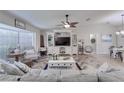 Bright living room featuring a large entertainment center and stylish coastal decor at 949 Springview Nw Ave, Port Charlotte, FL 33948