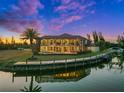 Stunning waterfront home features a screened lanai, private dock, and access to tranquil waters at 10580 Poughkeepsie Cir, Port Charlotte, FL 33981