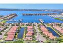 Aerial shot of a waterfront neighborhood with stunning marina views, luxury homes, and easy boating access at 303 11Th E Ave, Palmetto, FL 34221