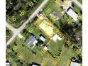 Aerial view showcasing property boundaries and home location with a spacious lot at 4344 Commercial St, Port Charlotte, FL 33953