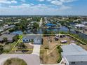 Aerial shot showcasing the home's position on a canal with defined property lines at 453 Carolyn Ln, Punta Gorda, FL 33950