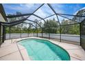Enjoy this screened-in pool perfect for outdoor relaxation and entertainment with an adjacent fenced yard at 7135 Tropicaire Blvd, North Port, FL 34291