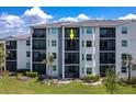 Condo building featuring multiple balconies providing scenic views and outdoor living spaces at 14051 Heritage Landing Blvd # 536, Punta Gorda, FL 33955