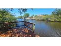 Water view from backyard deck, showcasing waterfront lifestyle at 17356 Gulfspray Cir, Port Charlotte, FL 33948