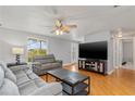 Bright living room offering hardwood floors, comfortable seating, and lots of natural light at 218 Parkview Dr, Venice, FL 34293