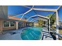Enjoy the outdoors with a screened-in pool and patio area perfect for relaxation and entertainment at 23344 Van Buren Ave, Punta Gorda, FL 33980