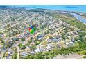 A beautiful aerial view of a waterfront neighborhood featuring lush greenery and easy access to stunning water views at 3319 Shamrock Dr, Venice, FL 34293