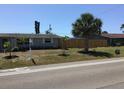 Charming single-story home with a well-maintained lawn and mature palm trees at 3319 Shamrock Dr, Venice, FL 34293
