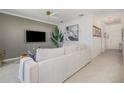 Modern living room with a plush sofa, TV, and stylish decor at 43050 Greenway Blvd # 645, Punta Gorda, FL 33982