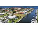 An aerial view of a waterfront home with a private dock and swimming pool at 48 Hibiscus Dr, Punta Gorda, FL 33950