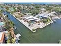 Beautiful waterfront property with a private pool and dock, providing direct access to the bay for boating and recreation at 5181 Sandy Shore Ave, Sarasota, FL 34242