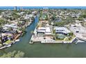 Stunning waterfront property with a private pool, dock, and beautifully landscaped backyard, perfect for entertaining at 5181 Sandy Shore Ave, Sarasota, FL 34242