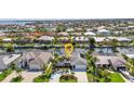 Beautiful waterfront home featuring lush landscaping, a private dock, and scenic canal views, ideal for boating enthusiasts at 80 Hibiscus Dr, Punta Gorda, FL 33950