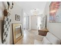 Inviting foyer boasts a neutral color palette, decorative lighting, and sophisticated accents at 95 N Marion Ct # 135, Punta Gorda, FL 33950
