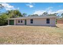 Charming single story home featuring an attached garage and well-maintained lawn at 105 Biscayne Dr, Port Charlotte, FL 33953