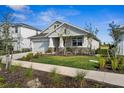 Beautifully landscaped front yard with a well-maintained lawn and inviting walkway at 16029 Mulrion Blvd, Punta Gorda, FL 33982