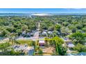 An aerial view showcases this property's prime location surrounded by lush greenery near the waterfront at 2002 Central Ave, Sarasota, FL 34234