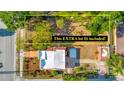 This property includes an extra lot surrounded by mature trees, providing ample space and privacy at 2002 Central Ave, Sarasota, FL 34234