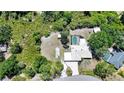 Spacious lot with a private swimming pool, lush green surroundings, and a well-maintained single-Gathering home at 22435 Fortune Ave, Port Charlotte, FL 33954