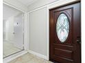 Foyer featuring a paneled door and neutral finishes at 31037 Prairie Creek Dr, Punta Gorda, FL 33982