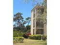 Beautiful condo exterior showing well-maintained grounds and landscaping at 618 Bird Bay S Dr # 109, Venice, FL 34285