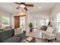 Inviting living room featuring modern furnishings and natural light and a sliding wood barn door at 7413 S Elliott St, Tampa, FL 33616