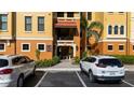 Inviting condo featuring private entries, vibrant stucco, and lush landscaping at 95 Vivante Blvd # 9524, Punta Gorda, FL 33950