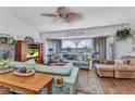 Bright living room boasts stylish decor, hardwood floors, large windows, and plenty of natural light at 1372 Annette St, Punta Gorda, FL 33980