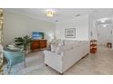 Cozy living room with comfortable seating, a stylish TV console, and a serene ambiance at 14061 Heritage Landing Blvd # 445, Punta Gorda, FL 33955
