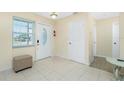 Welcoming foyer with neutral tile flooring, offering a bright and airy entrance at 159 Godfrey Ne Ave, Port Charlotte, FL 33952