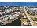 Waterfront neighborhood with canal access and various roof colors at 1711 Boca Raton Ct, Punta Gorda, FL 33950