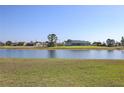 Beautiful waterfront view from the backyard, showcasing the tranquil pond at 1856 Nuremberg Blvd, Punta Gorda, FL 33983