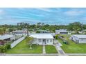 Quaint single-story home featuring a well-maintained lawn and a traditional design at 2321 Dallas St, Port Charlotte, FL 33952