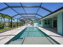 Screened-in pool with a covered lanai, perfect for enjoying sunny days at 25273 Paraguay St, Punta Gorda, FL 33983