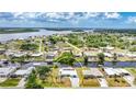 Aerial view of neighborhood home with canal access, highlighting community and surrounding landscape at 27385 Voyageur Dr, Punta Gorda, FL 33983