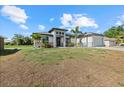 Charming home features a spacious two-car garage and a dry lawn at 3544 Monfero Ave, North Port, FL 34286