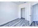 Bright bedroom featuring a closet, modern flooring, white trim, and ample natural light at 4285 Oak Terrace Cir, Port Charlotte, FL 33953