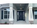 Elegant front entrance with sidelights and transom window at 13236 Pace Cir, Port Charlotte, FL 33981